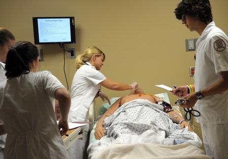 Nursing students work on simulations in Providence Hall. - Photo by Morris Abernathy