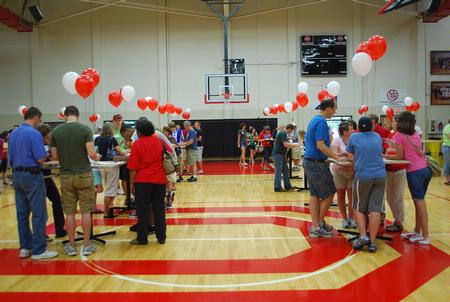 Incoming freshmen and their family members gather in the Fred DeLay Gym to check in and receive room keys during New Student Move In Day.  - Photo by Abigail Harris