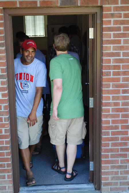 Diego Santos, sophomore business administration major, leaves a dorm room where he and other Union students, faculty, and staff are helping move in a new student. - Photo by Abigail Harris