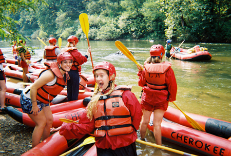 Rafters Kathryn Kiper and Kathleen Lokey display their excitement after the first set of rapids on the Upper Nolichucky River during the white water rafting Adventure Program. - Photo by Cam Tracy