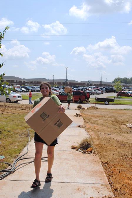 Elsie Krinsky, sophomore nursing major, helps her new roommate move into the recently constructed Hope Complex on Move In Day.  - Photo by Victoria Stargel
