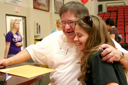 Gary Williams, associate vice president for university relations and alumni services, greets incoming freshman Chelsea Carrier from Morristown, Tenn. with an embrace. - Photo by Deanna Santangelo