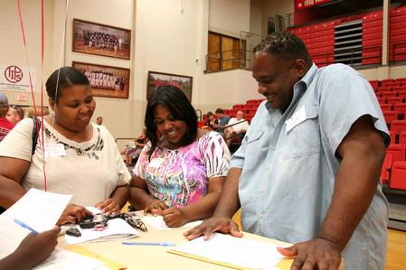 Incoming freshman, Stephanie Nicols from Memphis, Tenn, fills out housing paperwork with her mother Chelcie and her father Stacey during Move In Day. - Photo by Deanna Santangelo