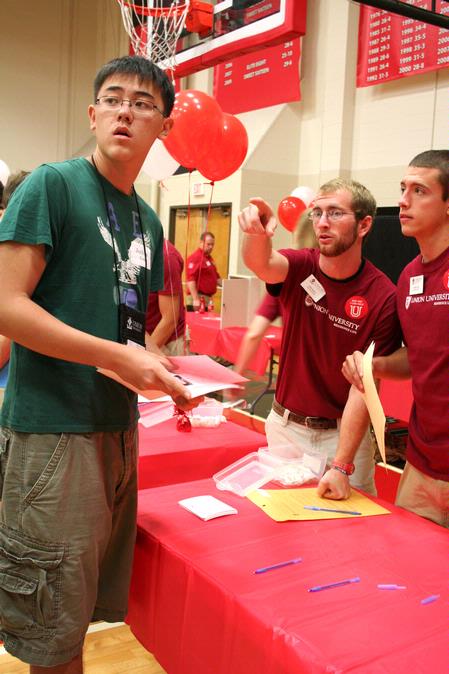 John Shell, junior youth ministry major, and Casey Kidd, senior theology major, give direction to new student, Joshua Kim from Palisades Park, NJ, on Move In Day. - Photo by Deanna Santangelo