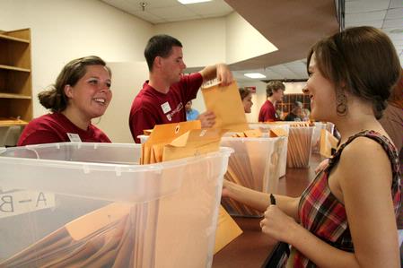 Lauren Laster, senior political science major, greets new freshman, Maryann McClendon from Cuthberth, GA, on Move In Day.  - Photo by Deanna Santangelo