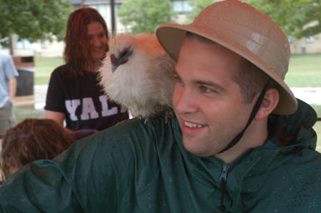 Mark VanderHaar, Director of Student Programs, bonds with a chicken at Fall Fest 2003. - Photo by Jonathan Blair