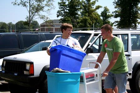 Skipper Boatwright, a sophomore theology major helps incoming freshman Zach Thompson move into his dorm. - Photo by Deanna Santangelo