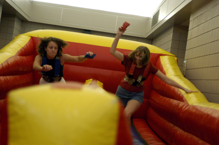Graduates Meah Harrington and Johnna Green jockey for position at Fall Fest 2003. - Photo by Jonathan Blair