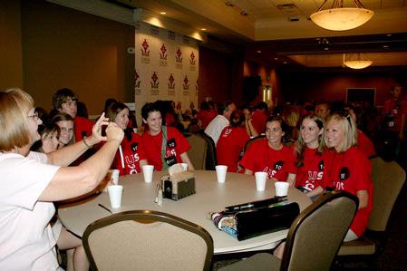 Carol Weaver, professor of biology, takes a picture of some of the incoming freshman biology students during Dinner with your Department.  - Photo by Deanna Santangelo