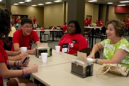 Pamela Binns-Turner, associate professor of nursing, talks with incoming freshmen about the nursing department at the annual Dinner with your Department event.  - Photo by Deanna Santangelo
