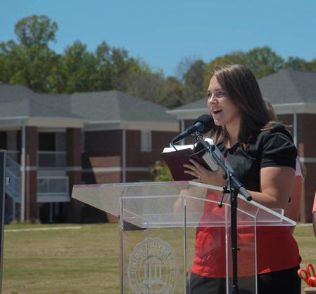 Kristen Wells, assistant resident director, reads scripture at the dedication of the Hope Residence Complex. - Photo by Morris Abernathy