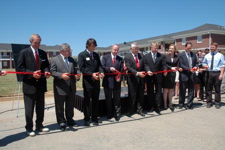 Prominent members of the Union family participate in the ribbon cutting ceremony for the dedication of the Hope Residence Complex.  - Photo by Beth Spain