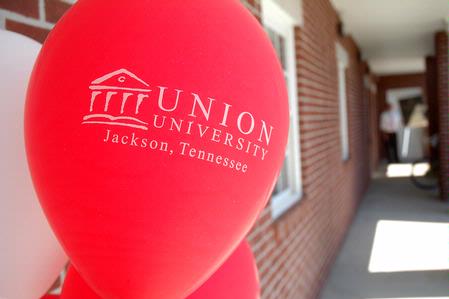 Red and white Union balloons welcomed visitors to the dedication of the Hope Residence Complex.  - Photo by Beth Spain