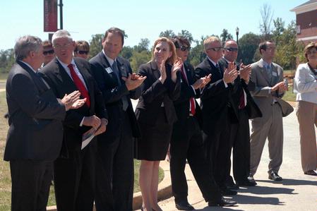 Faculty and trustees applaud at the dedication of the Hope Residence Complex. - Photo by Beth Spain