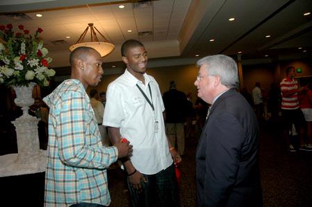 Randall Phillips, associate professor of family studies and director of research, gets to know juniors Skyler Vaden and Antoine Hall during the SGA/President's Reception.
 - Photo by Deanna Santangelo
