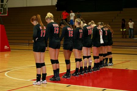 The lady bulldogs volleyball team joins hands in a word of prayer before their game again Lyon College. Union won the match 3-1. - Photo by Deanna Santangelo