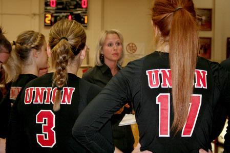 Kelly Elliot, head coach, talks with the volleyball team during a time out in a match against Lyon College. The Lady Bulldogs won 3-1. - Photo by Deanna Santangelo