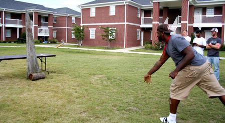 Shane Burrell, junior sports management major, represents his team during the hatchet throwing competition at the Watters Great Outdoors event. - Photo by Deanna Santangelo