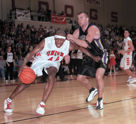 Robert Joseph, No. 44, drives to the basket during Union's Homecoming 2002 game against Trevecca Nazarene.  Union won 87-82. - Photo by Jim Veneman