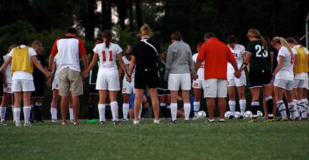 Delta State players gather with the Lady Bulldog soccer team for prayer after their game. - Photo by Ebbie Davis