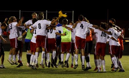 The Bulldog soccer team gathers together in celebration after their 3-0 win against Delta State. - Photo by Ebbie Davis