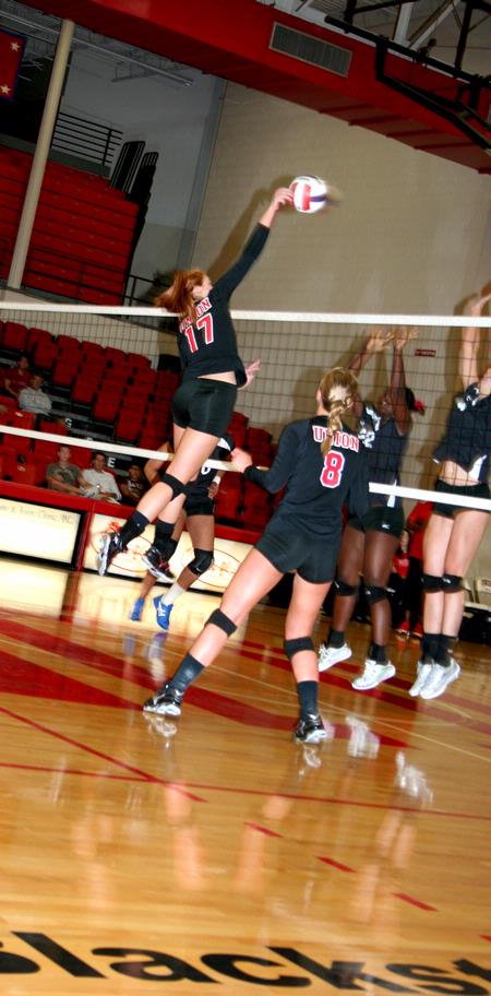 Ana Sims spikes the ball against Martin Methodist . - Photo by Deanna Santangelo