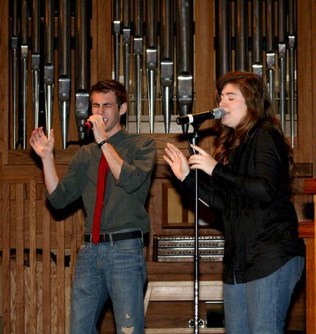 Brad Carrington, junior church music major, and Kristen Voorhies, senior music major, sing during chapel. - Photo by Deanna Santangelo