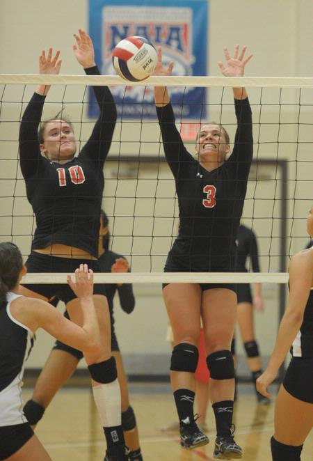 Shelby Swink (10) and Heather Lieberman (3). - Photo by Morris Abernathy
