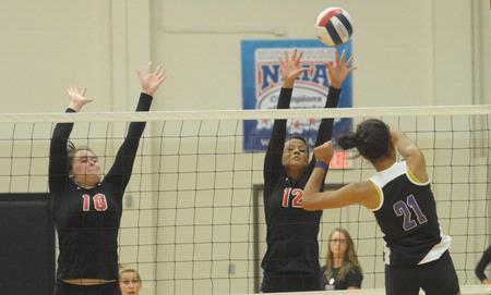 Shelby Swink (10) and Marcela Madeira (12). - Photo by Morris Abernathy