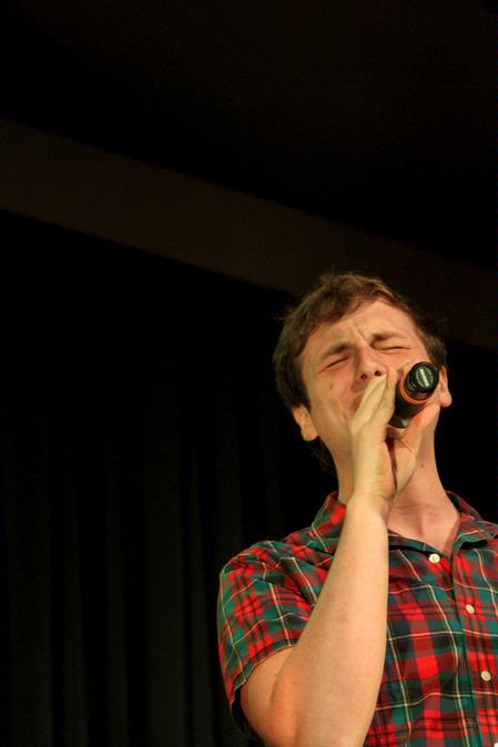 Sidney Burngasser, sophomore music education major, sings a solo with the group "On Holidays." This group performed various songs about summertime and were ultimately the winners of the competition. - Photo by Deanna Santangelo