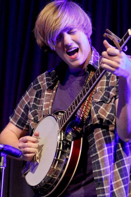 Austin Gray, freshman English major, performs with the band Flying Colours during All-Sing.  - Photo by Deanna Santangelo