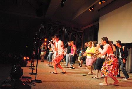 "On Holidays" performs their large group act during All-Sing.  - Photo by Victoria Stargel