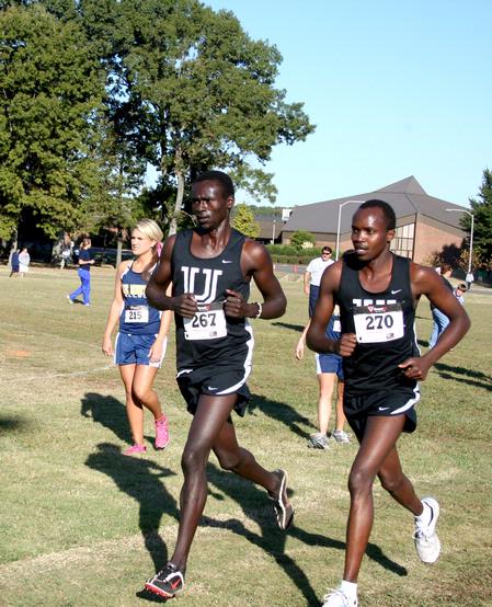 Alex Bett, junior computer science major, and Edwin Kurgat, freshman business administration major, finish up a cross country race. - Photo by Deanna Santangelo