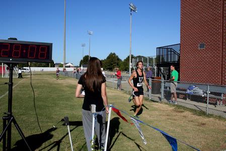 Caleb Creel, freshman theology major, finishes up a race for the cross country team. - Photo by Deanna Santangelo