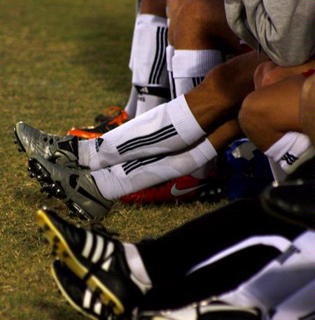 Soccer players rest on the bench during the game against Mid-Continent University.  - Photo by Ebbie Davis
