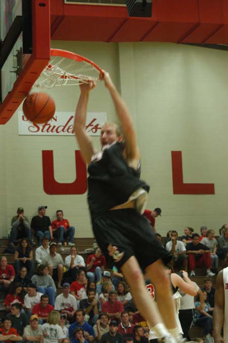 Junior forward Michael Palmer dunks during the Bulldog Madness warm-up session. - Photo by Courtney Ross