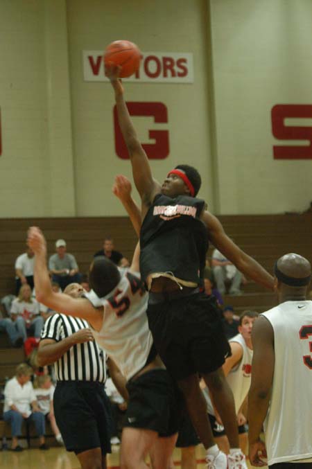 Freshman center Pierry Valmera elevates above everyone to gain the opening tip of the men's scrimmage during Bulldog Madness. - Photo by Courtney Ross