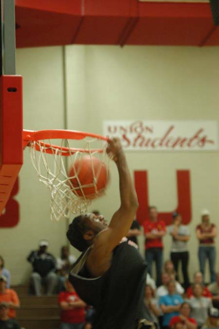Marcus Cooper performs a reverse dunk during the Bulldog Madness Dunk Contest. - Photo by Courtney Ross