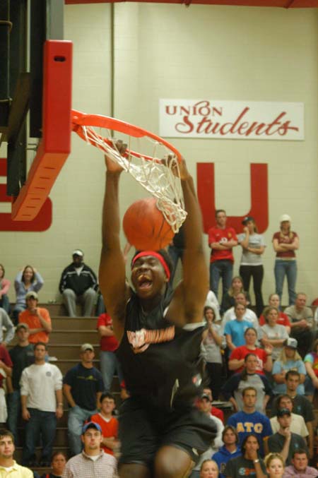 Freshman Pierry Valmera has fun with his dunks during the Bulldog Madness Dunk Contest. - Photo by Courtney Ross