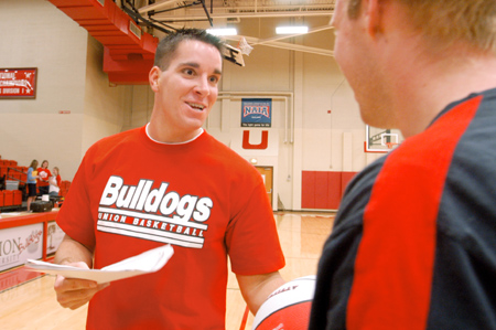 Senior Michael Simpson, Bulldogs guard, interacts off the court at Meet the Bulldogs Oct. 14. - Photo by Kristen Nicole Sayres