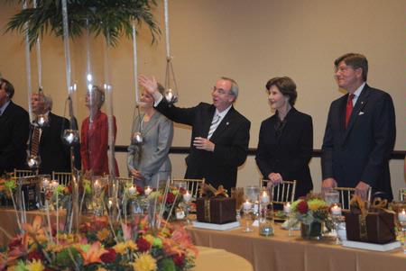 Laura Bush, former first lady of the United States, is introduced to donors during the meal before the 13th annual Scholarship Banquet. - Photo by Morris Abernathy