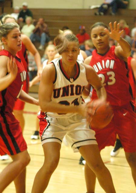Stephanie Clark (33) is in the midst of a double team by Jessica Henson (10) and Christina Smith (23) during the Bulldog Madness scrimmage. - Photo by Courtney Ross