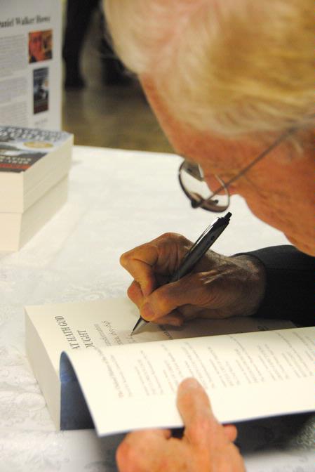 Dr. Daniel Walker Howe, Pulitzer Prize-winning author, signs a copy of his book, <em>What Hath God Wrought</em>, after lecturing for the Carls-Schwerdfeger History Lecture Series. - Photo by Victoria Stargel