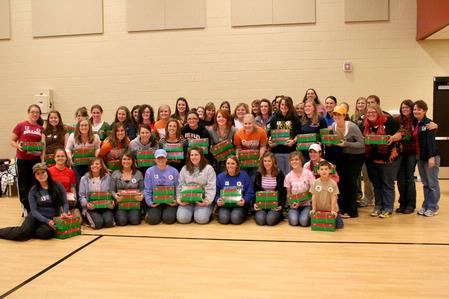 Students and faculty hold the boxes that they helped pack for Operation Christmas Child during Campus and Community Day.  - Photo by Deanna Santangelo