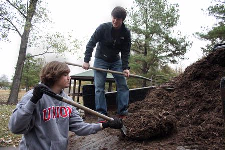 Ben Erickson, freshman psychology major, and Nic Seaborn, senior Christian studies major, volunteer at Liberty Garden Park during Campus and Community Day. - Photo by Ebbie Davis