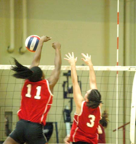Union juniors Gladys Wandera (11) and Nicole Garber (3) block a Lee Univ. shot. - Photo by Steven Aldridge