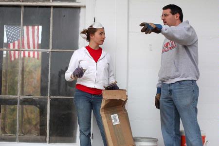 Mary Alisa Techentin, senior history major, works with Keith Bates, associate professor of history, on restoring an 1800s home that is now located at Casey Jones Village. The history department helped with the project as part of Campus and Community Day.  - Photo by Kristi McMurry Woody
