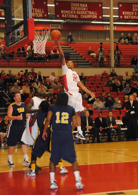 Stan McNeil jumps over his Truett-McConnell College opponents to score in the homecoming game.  - Photo by Victoria Stargel