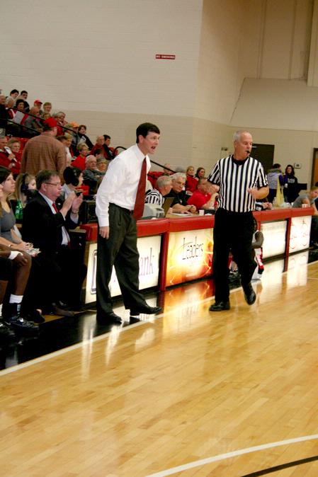 Mark Campbell, head women's basketball coach, calls out plays during the homecoming game against University of St. Francis. - Photo by Deanna Santangelo
