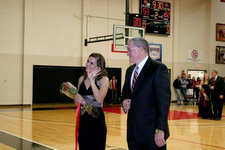 Anna Ezell, junior intercultural studies major, waves to the crowd during homecoming festivities. Ezell was a representative for the homecoming court.  - Photo by Deanna Santangelo